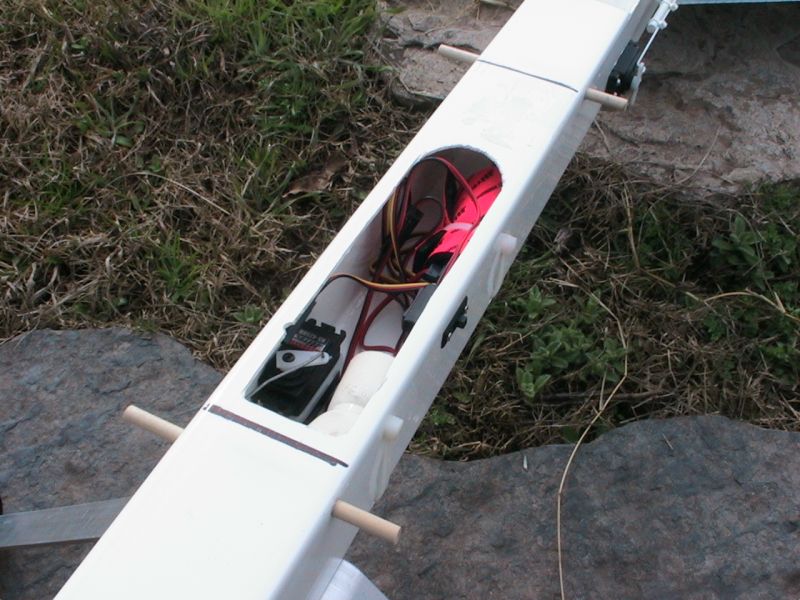  The throttle servo, receiver battery (in white foam), and receiver (in orange foam).