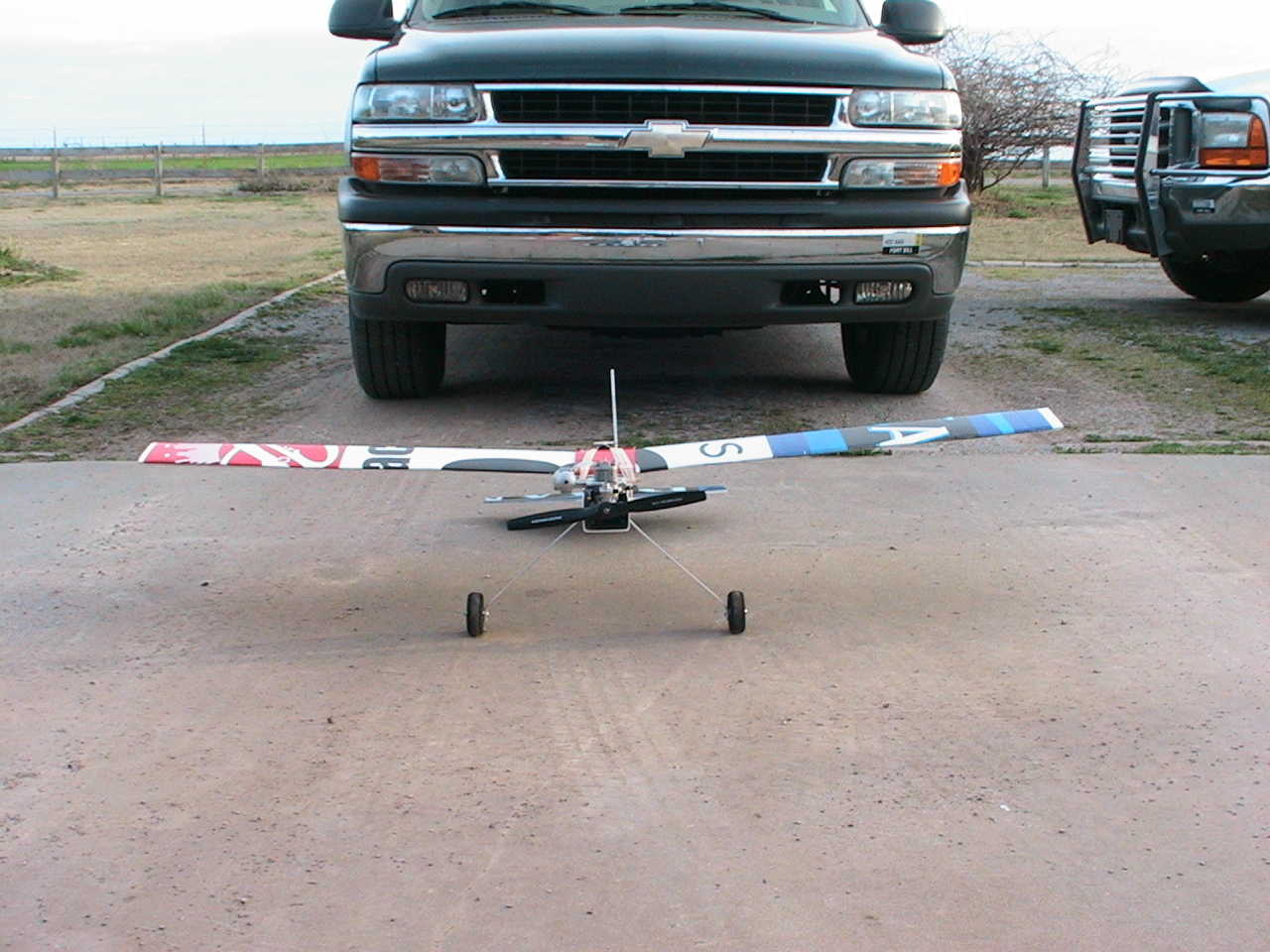  The wingspan is 60 inches.  I placed the plane in front of the Chevy Tahoe for scale comparison.